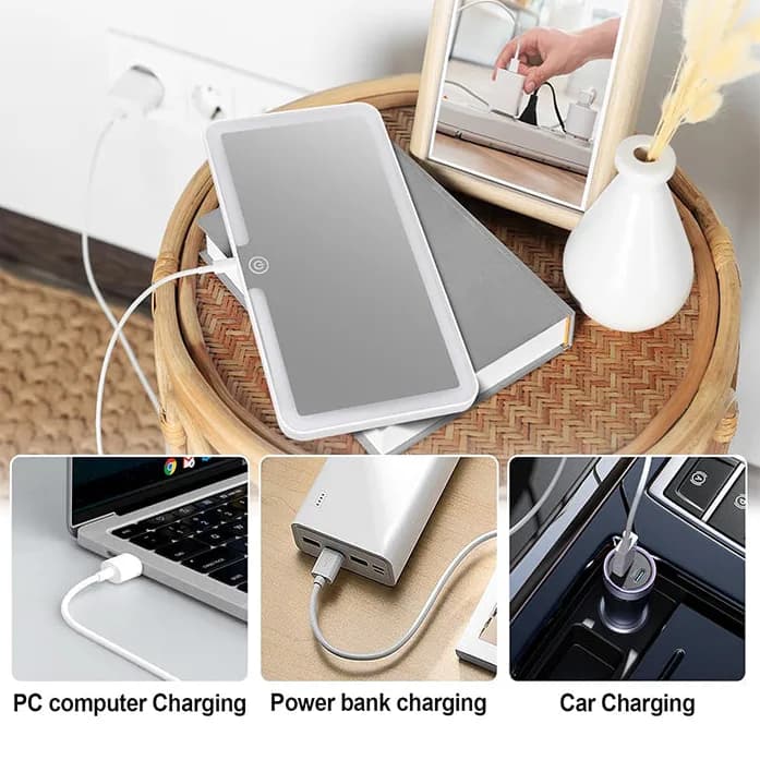 آینه GMR-48 روی میز کنار کابل شارژ، همراه با سه نمونه شارژ از درگاه USB Type-C: لپ‌تاپ، پاوربانک و شارژر فندکی خودرو